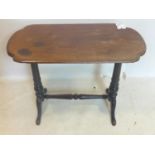 An antique side table with oblong oak top raised on ebonized base, H.72 W.88 D.43cm