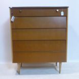 A 20th century teak chest of 5 drawers, raised on tapered legs, H.102 W.86 D.46cm