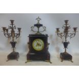 A French black slate and variegated marble clock garniture, the Arabic dial signed Fouilleul