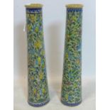Two Persian Isfahan bamboo vases, decorated with stylised flowers, H.70cm