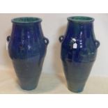 Two Persian blue glazed Sharab wine vessels, H.85cm