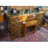 A Georgian style walnut pedestal desk, H.75 W.136 D.69cm