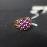 An 18ct yellow gold pink tourmaline and pink sapphire cluster ring, Size: U 1/2, 5.7g