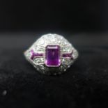 A platinum, diamond and pink sapphire ring in the Art Deco style with ruby detailing, Size: M 1/2,
