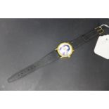 A wristwatch with picture of Saddam Hussein to dial, the caseback marked 'GI Golden Peel,