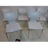 A set of 5 designer white leather and stainless steel chairs