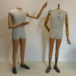 A pair of 1950's shop display mannequins with plaster and wood arms and legs, both fitted with shoes