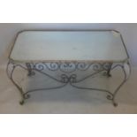 A vintage French wrought iron coffee table with mirrored top, H.53 W.98 D.56cm