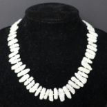 A silver and Japanese Biwa pearl necklace of 75 pearls L. 44cm with a matching pair of earrings