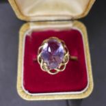 A boxed 9ct yellow gold ring set to the centre with a large, oval faceted amethyst, Size: M, 3.2g,