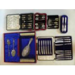 A collection of silver to include cased sets of forks and spoons, a dressing table set and two dutch