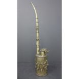 A Chinese white metal opium pipe, decorated with stylised flowers, H.27cm