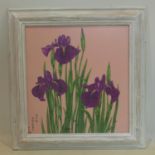 A framed and glazed Japanese painting on cotton of purple Irises on a pink ground, signed lower