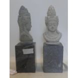 A pair of stone carvings of Buddha, on rectangular marble bases, H.36cm