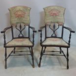 A pair of Art Nouveau high back armchairs, with stylised floral upholstered seat and backrest,