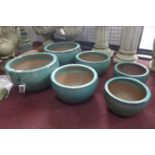 Two sets of three aqua glazed pots of graduating size, H.24cm Diameter 42cm (largest)