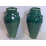 Two Persian green glazed Sharab wine vessels, H.80cm