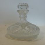 A Bohemian crystal decanter with stopper, having geometric and star decoration, H.25cm
