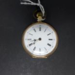 A gold plated French open face pocket watch, the white enamel dial with Roman and Arabic numerals,