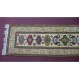 A Persian runner with geometric design, 323 x 85cm