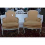 Two late 19th/early 20th century French cream and blue painted armchairs