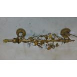 A gilt metal wall mounted light, with gilt metal leaf design to stem and having ceramic roses, H.