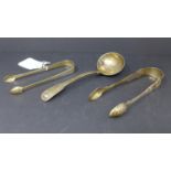 Two pairs of silver sugar tongs and a silver ladle, all hallmarked, gross weight 6.1 troy oz