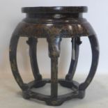 An early 20th century Chinese black lacquered and gilt painted barrel stool, H.48 D.42cm
