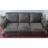 A contemporary stud bound leather sofa