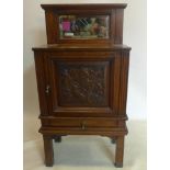 An Art Nouveau oak side cabinet, H.116 W.59 D.34cm