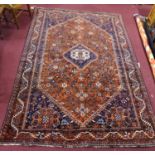 A South-West Persian Qashqai carpet, central diamond medallion with repeating petal motifs on a