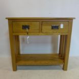 A contemporary light oak side table with 2 drawers, H.77 W.85 D.35cm