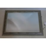 A contemporary silvered mirror with bevelled plate, 93 x 66cm