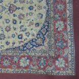 A 20th century Tabriz carpet with floral medallion, on a beige ground, contained by floral border,