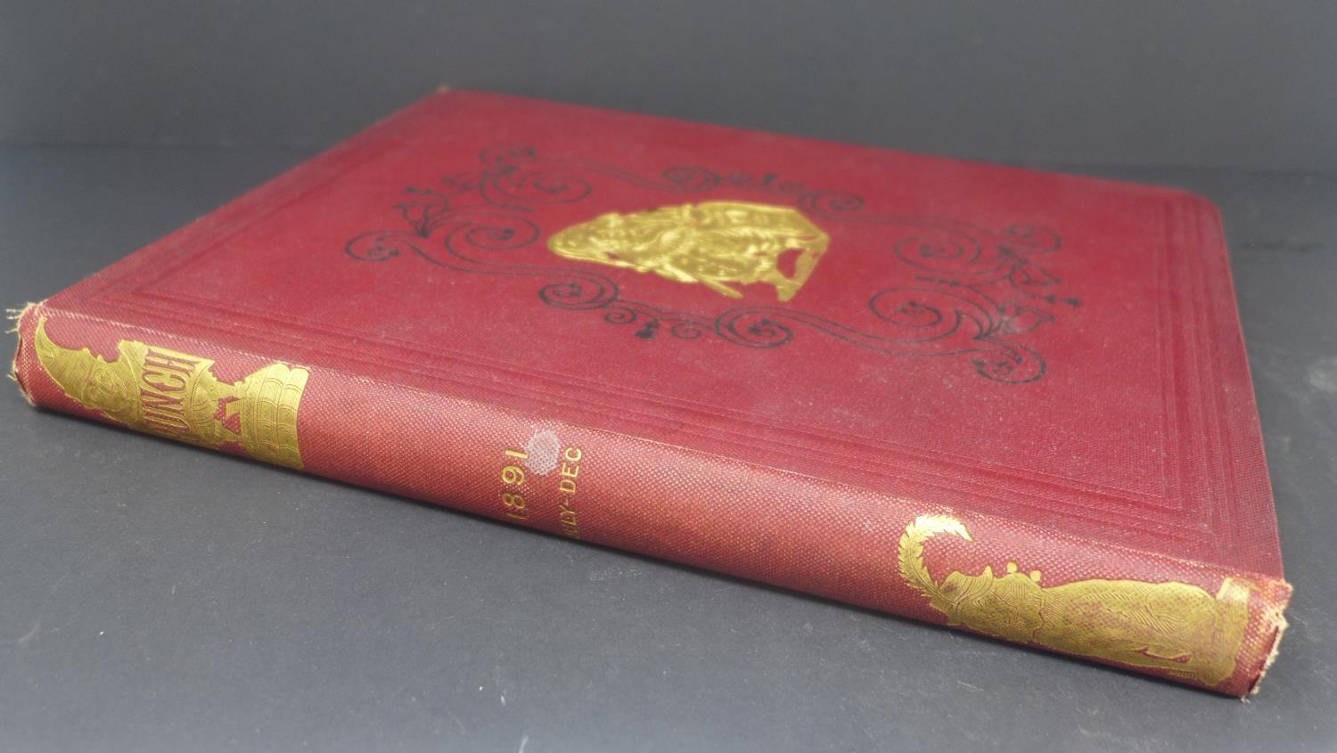 An 1891 July-Dec Edition of Punch magazine, red cloth bound and gilt cover, illustrated within, 28 x - Image 2 of 5