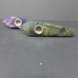 Two smoking pipes of obelisk form: one carved from a solid piece of amethyst, the other labradorite,