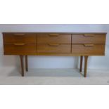 A 20th century teak sideboard with 6 drawers, raised on tapered legs, H.70 W.154 D.42cm