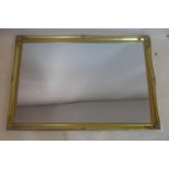 A 20th century gilt wall mirror, with floral decoration to frame, 100 x 69cm