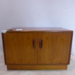 A 20th century teak low side cabinet, H.51 W.84 D.46cm