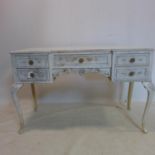 A 20th century cream painted dressing table, H.74 W.118 D.50cm
