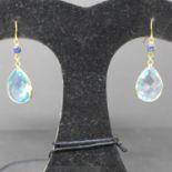 A pair of 14ct yellow gold sapphire and faceted blue topaz drop earrings, L. 3.5cm, Gross: 4.2g,