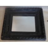 A late 19th century ebonized mirror with later bevelled plate, 69 x 57cm