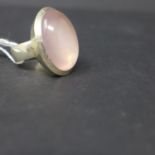 A sterling silver and polished rose quartz cabochon ring, 21.2g, rose quartz: 2.5 x 1.5cm