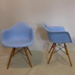 A pair of Eames style chairs