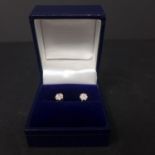A pair of 9ct yellow gold and 18ct white gold diamond stud earrings, boxed