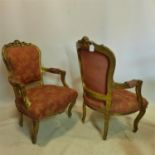 A pair of Louis XV style gilt wood armchairs