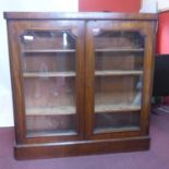 A Victorian mahogany glazed bookcase, raised on plinth base, H.122 W.125 D.27cm