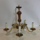 A quality vintage walnut and brass chandelier
