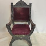 A Victorian carved oak Savonarola chair