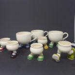 A collection of 1930's novelty Carlton ware comprising of 3 cups and 5 eggcups all with colourful